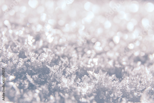 Snow winter background with snow texture closeup. Snow cristals macro. Wonderful winter holiday background. Christmas concept © jenyateua