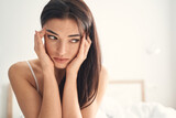 Young woman suffering from headache in the morning