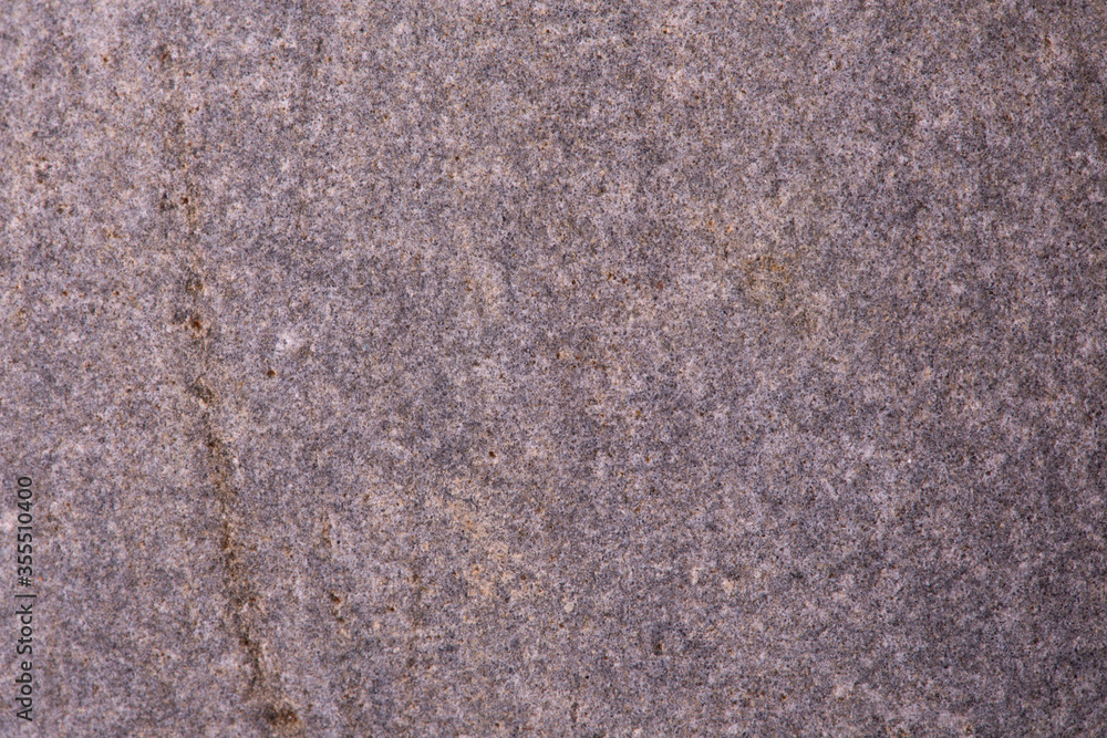 The texture of a gray stone, close-up. Background. The texture of a gray stone, close-up. Background.