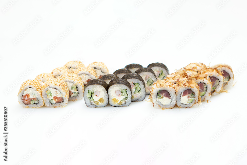 Sets of different sushi roles on a white background Sets of different sushi roles on a white background