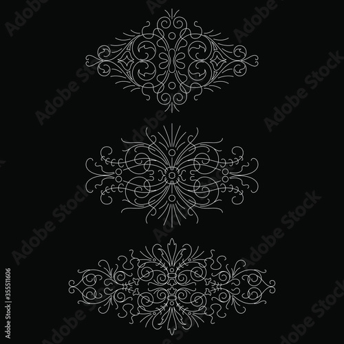 Calligraphic design elements isolated on black background set 1