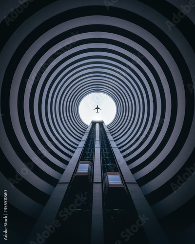 Look up Architecture symmetry cycle building with the plane on center