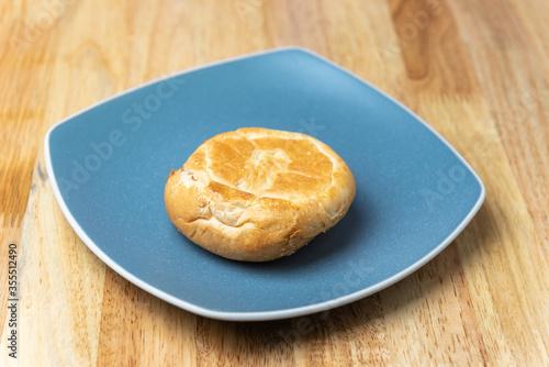 round bread in blue plate