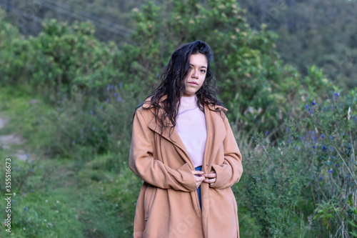 Model Woman poses in nature