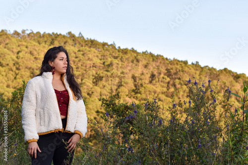 Model Woman poses in the mountain