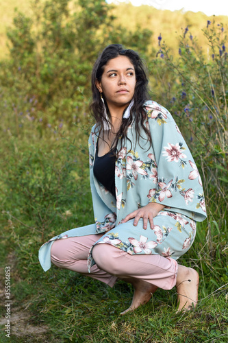 Model Woman poses in nature