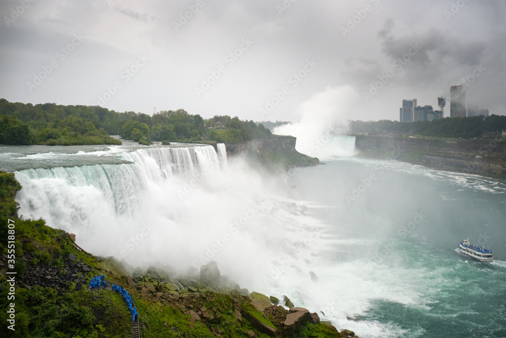 Tourists watching the rapids of the Niagara falls Tourists watching the rapids of the Niagara falls