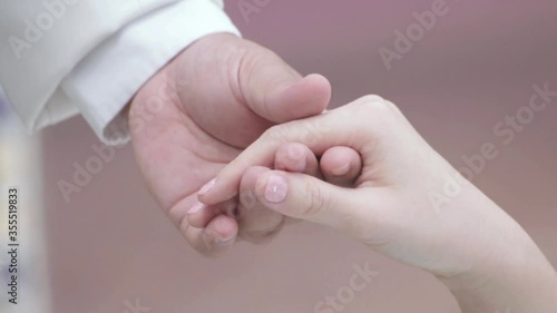 Close up holding hands of young men and women Shake hands with friends Love, happiness and friendship.