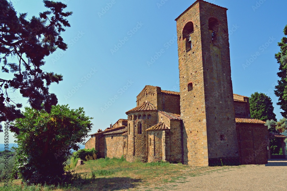 view of the external apsidal part of the 11th century Romanesque church of Santa Maria and San Leonardo located in Artimino in the municipality of Carmignano in the city of Prato in Tuscany, Italy