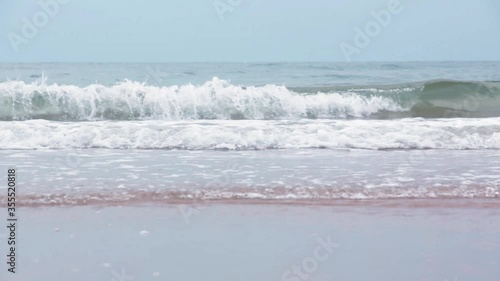 Beaches and ocean waves blowing sand White soft sponge sea in the south of Thailand 