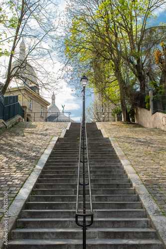 Obraz na płótnie Paris, Montmartre, romantic staircase, and the basilica Sacre-Coeur in backgroun