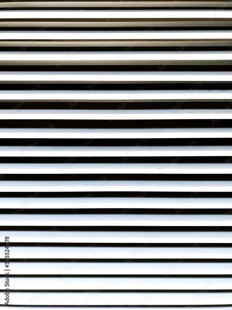 Fototapeta premium black and white striped shutter of window background.