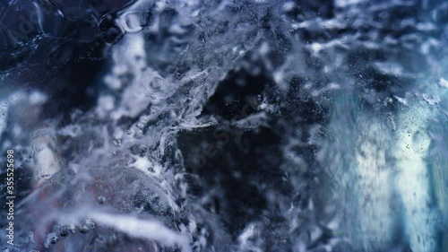 Blue underwater bubbling ice macro texture background