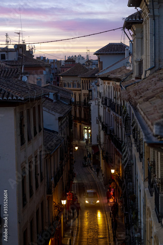 Scenic rooftop view of a quiet neighborhood street at dusk in Granada, Spain © piff