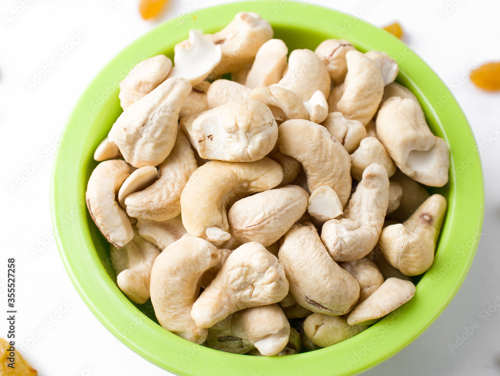 White raw cashew nuts in a white background stock image.
White raw cashew nuts in a white background stock image.