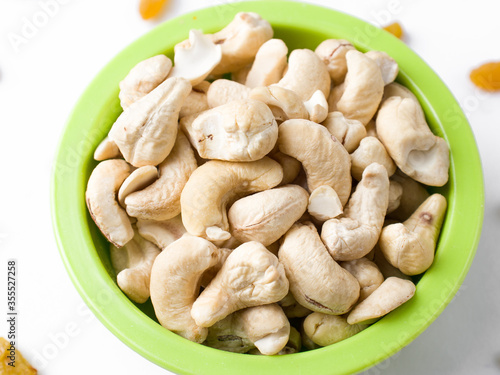 White raw cashew nuts in a white background stock image. 