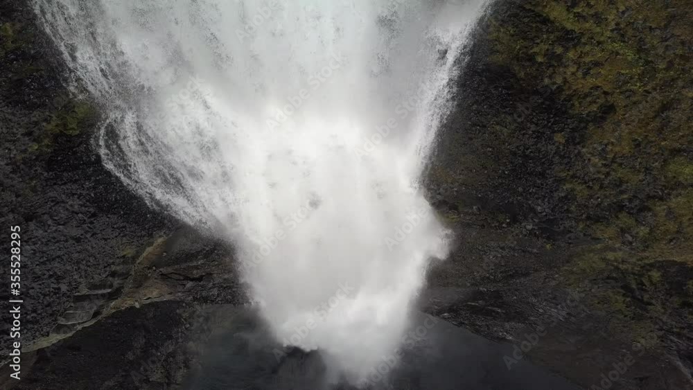 Haifoss waterfall in the highlands of Iceland, Aerial view. Dramatic landscape of Waterfall in Landmannalaugar canyon. (not graded DJI D-cinelike footage). Haifoss waterfall in the highlands of Iceland, Aerial view. Dramatic landscape of Waterfall in Landmannalaugar canyon. (not graded DJI D-cinelike footage).