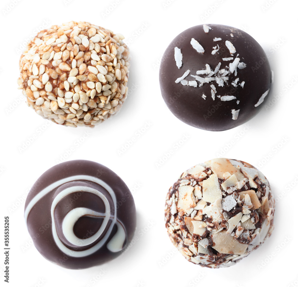 Set with different chocolate candies on white background, top view Set with different chocolate candies on white background, top view
