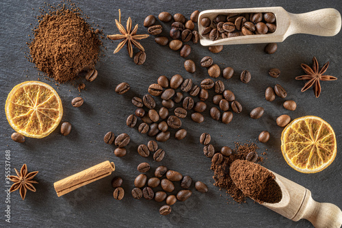 Fototapeta Naklejka Na Ścianę i Meble -  Espresso coffee beans for cup of dark caffeine breakfast on black cafe food or drink background. Morning energy concept and cheerfulness or evening refreshment. Copy space, top view