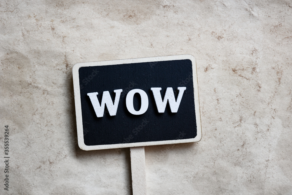 Wow concept - Signpost on paper background Wow concept - Signpost on paper background
