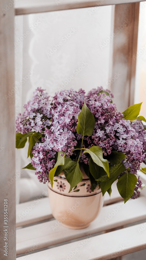 Bouquet of lilacs in a box.