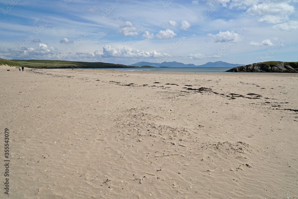 The beach at Abeffraw with the mountains of Snowdonia National Park in the distance