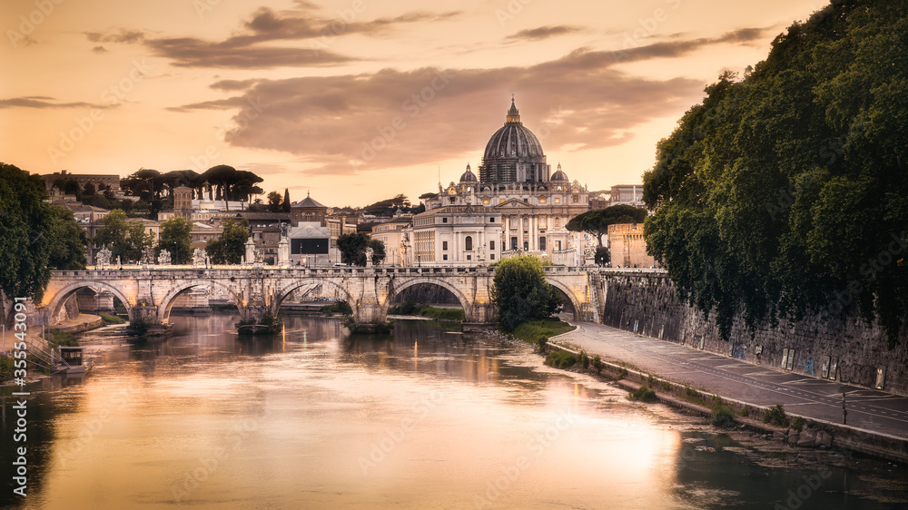 rome tiber and saint peter basilica at sunset