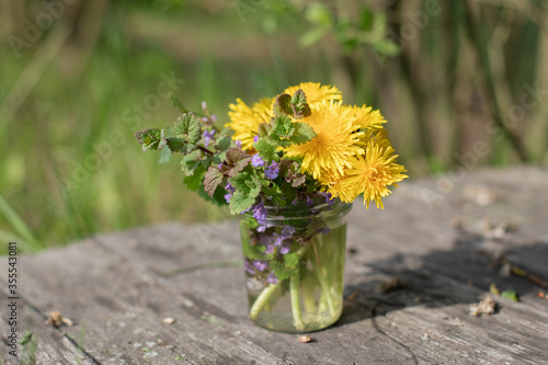 Beautiful bouquet of wildflowers in a glass jar.
