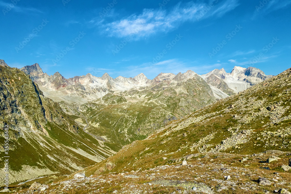 Picturesque mountain scenery with cumulus clouds. Wildlife. Hiking.