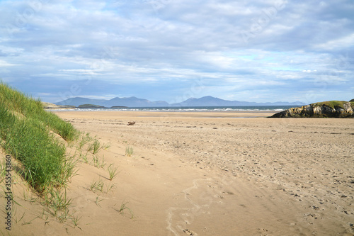 The beach at Aberffraw with the mountains of Snowdonia National Park in the distance © David