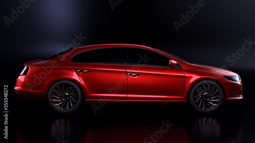 Red sedan on dark background.Side view.