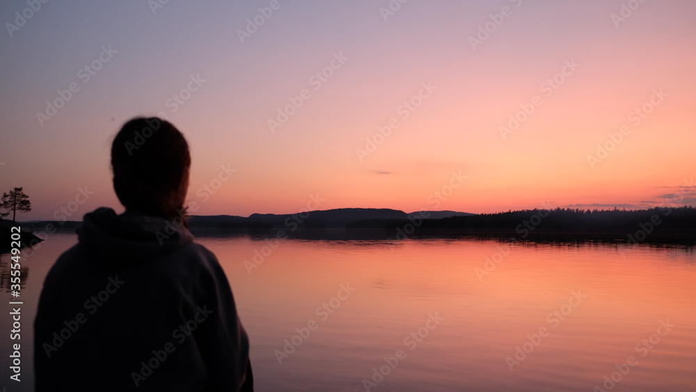 Silhouette of a woman in a sunset