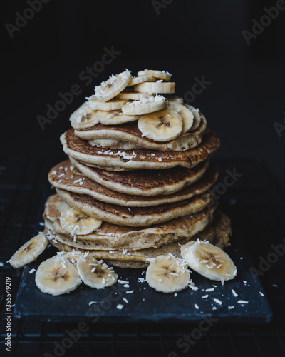 Vegan banana pancakes on dark background