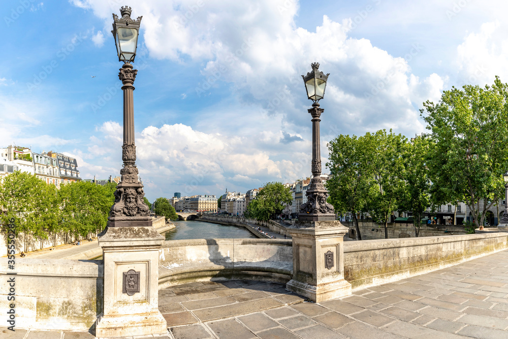 Paris, France - June 3, 2020: Paris cityscape. View from famous Pont Neuf with traditional lamppost. France.