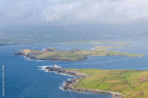 Beautiful view of Valentia Island Lighthouse at Cromwell Point. Locations worth visiting on the Wild Atlantic Way. Scenic Irish countyside on sunny summer day, County Kerry, Ireland.