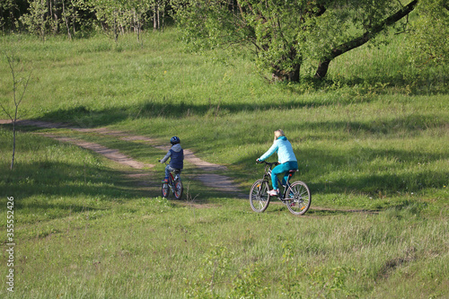 family cycling in nature