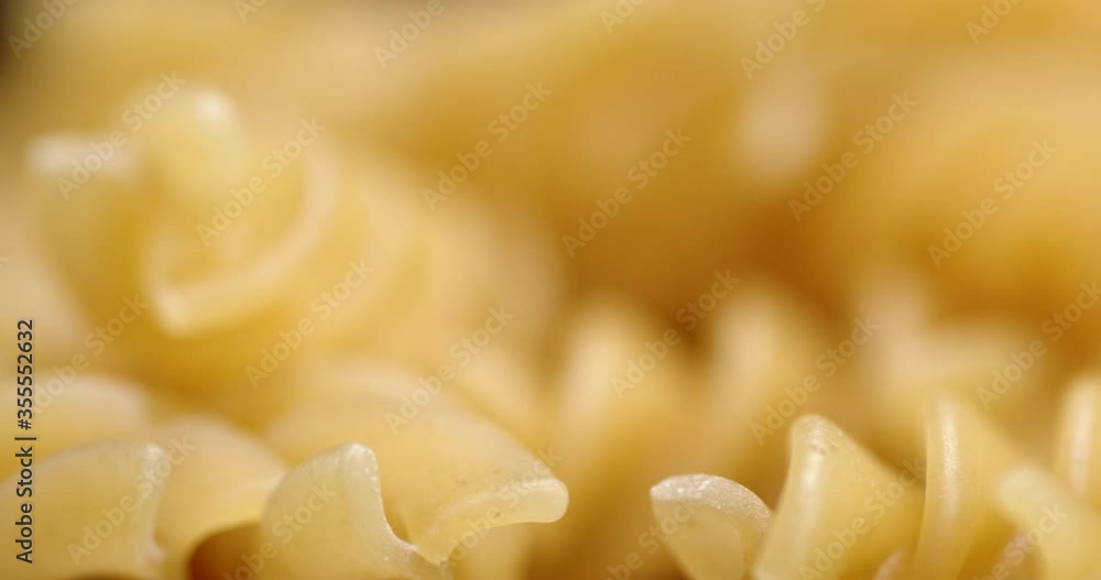 Fusilli pasta dry slowly rotates. Fusilli pasta dry slowly rotates.