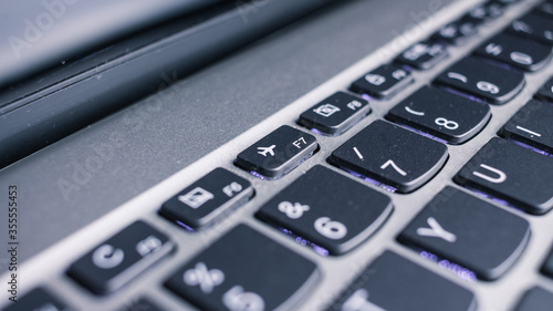 Notebook keyboard with nice light. Business concept. Work at home concept. Wifi. Laptop. Airplane mode