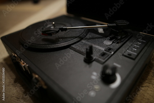 Retro vinyl record player. Vintage Gramophone. Black vinyl player. 