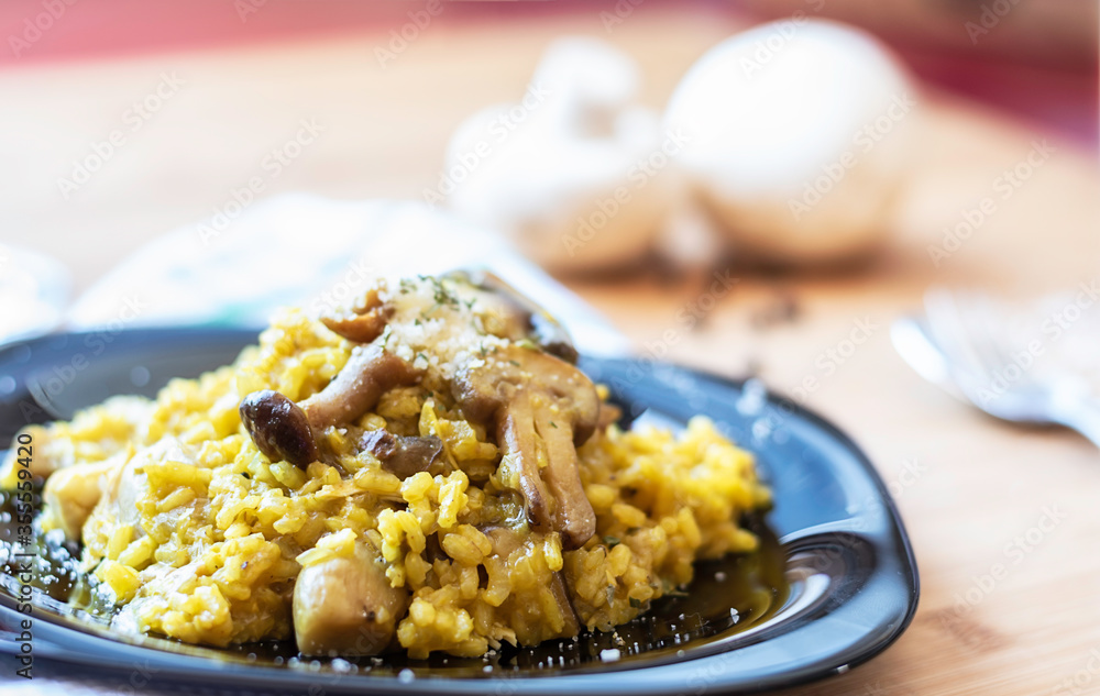 Close-up of a mushroom risotto with the background out of focus - Focus on the rice