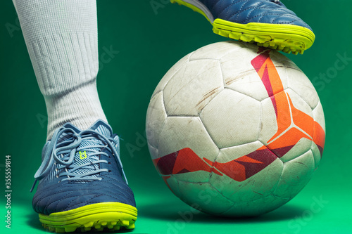 close up of isolated soocer feet player with a soccer ball