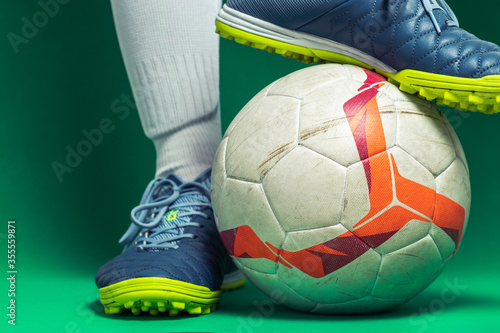 close up of isolated soocer feet player with a soccer ball photo