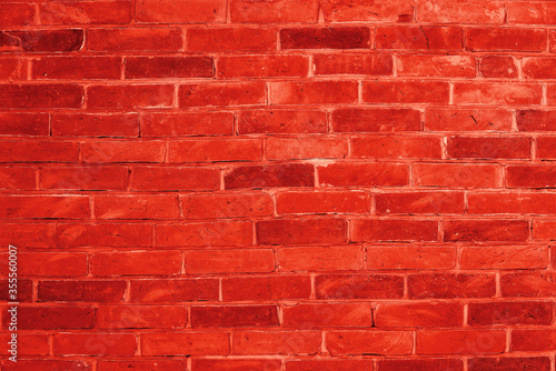 Red brick wall background inside of the room.