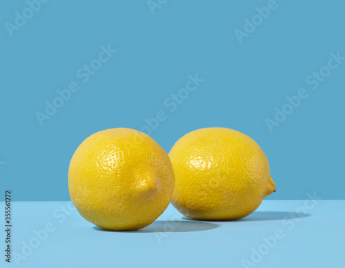 fresh lemons on blue background