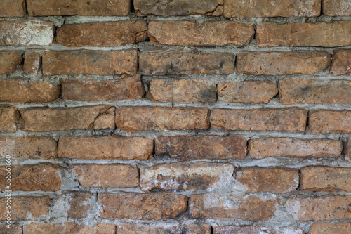 Old brick wall, texture of bricks up close.