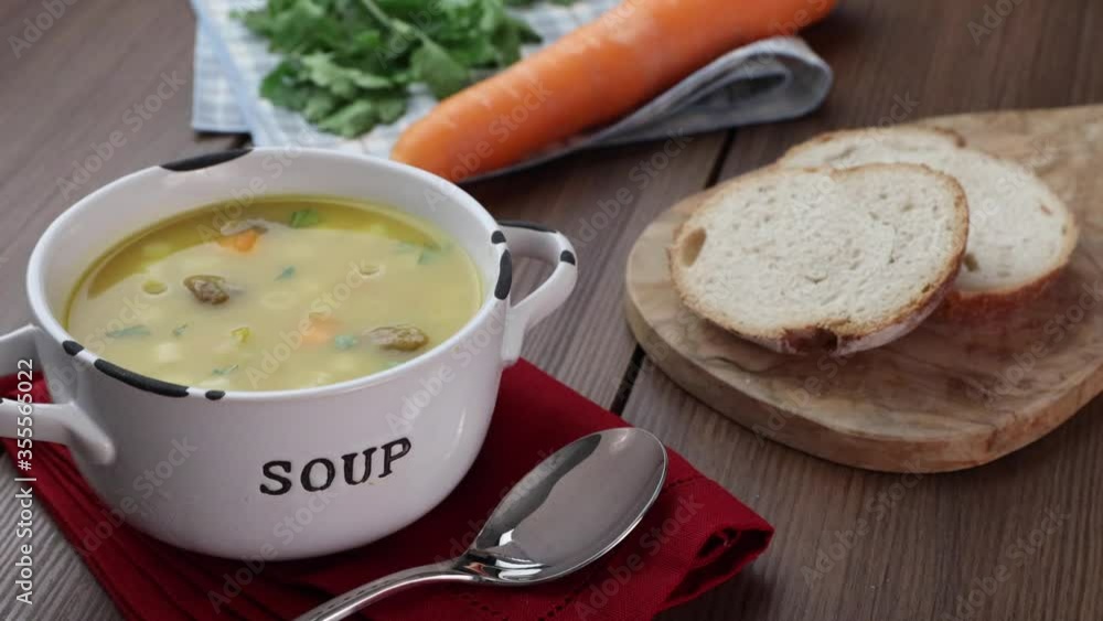 A bowl of delicious brazilian soup with beef, vegetables and noodles. A bowl of delicious brazilian soup with beef, vegetables and noodles.