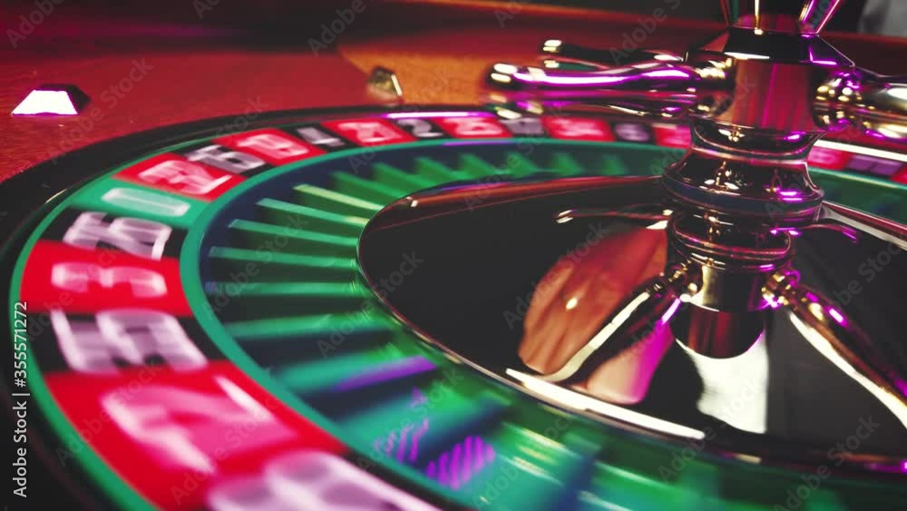 Croupier spinning the Roulette wheel winning number 13 close up at the Casino Croupier spinning the Roulette wheel winning number 13 close up at the Casino