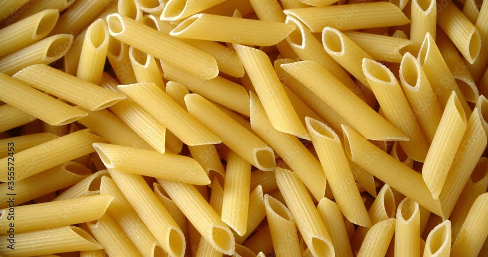 Dry Penne pasta to prepare dinner slowly rotates. Dry Penne pasta to prepare dinner slowly rotates.