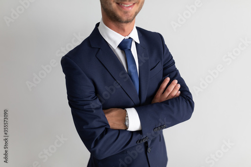 Business man smiling with crossed arms