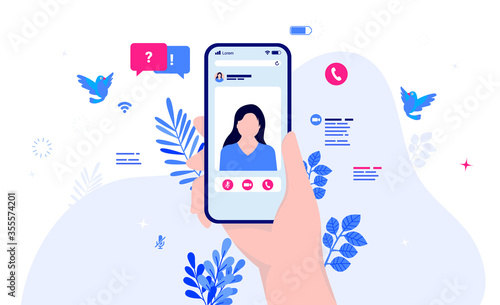 Video call - Hand holding phone with live stream of female colleague, conversation icons and elements in background. Converse through video, remote meeting and phone call concept. Vector illustration.